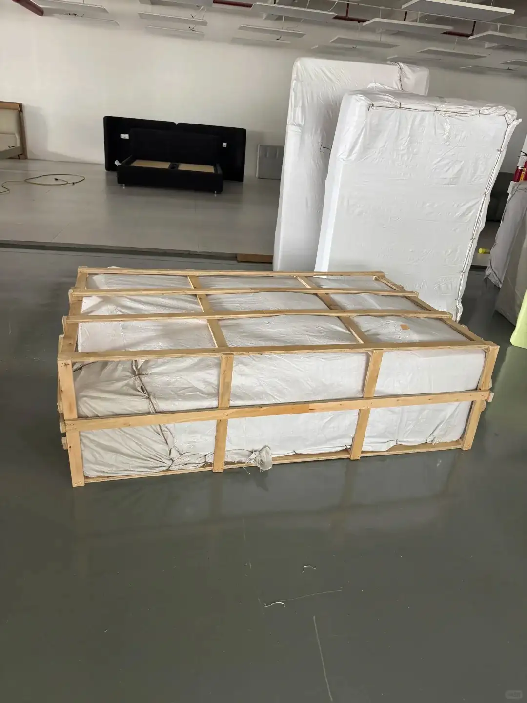 Building materials secured in export wooden crates