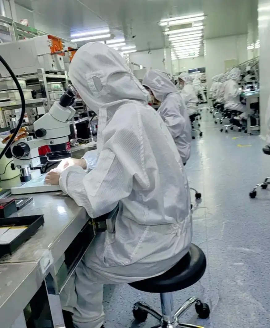 Technicians working in a Shenzhen PCBA production cleanroom