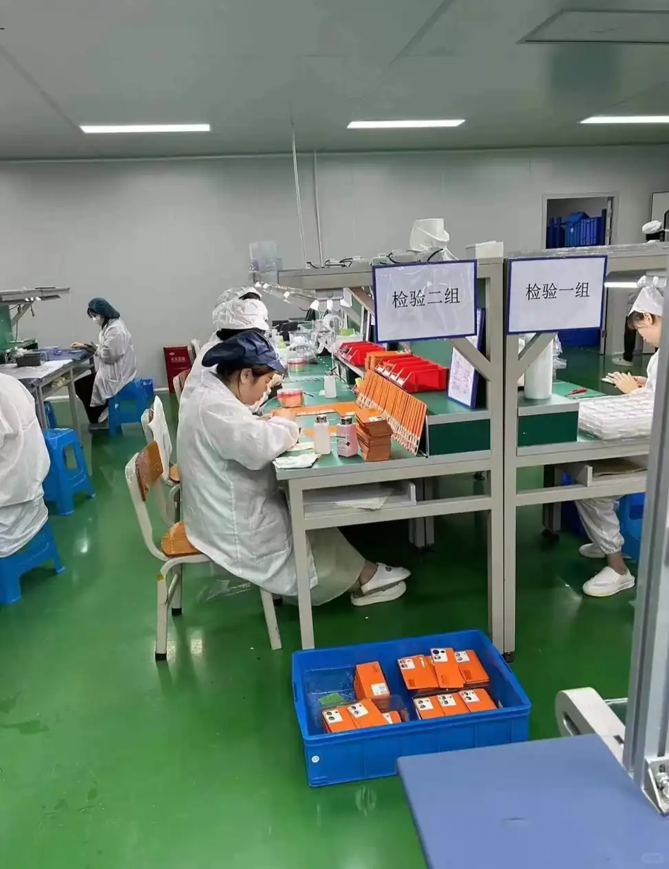 Gloved inspector checking cosmetic glass packaging